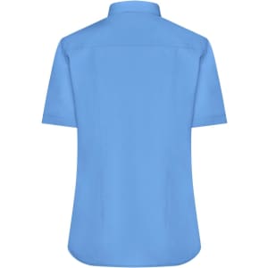 A short-sleeved button-up shirt in light blue, featuring a back yoke and a logo.