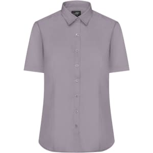 A short-sleeved, button-up ladies shirt in a light purple shade with a collar and logo.