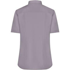 A short-sleeved button-up shirt in a soft grey colour, featuring a collar and a logo on the back.