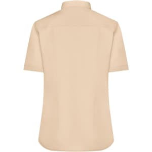 A beige, short-sleeved button-up shirt featuring a back yoke and a logo.