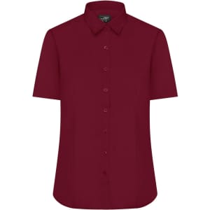 A burgundy button-up shirt featuring short sleeves and a collar, with a logo on the chest.