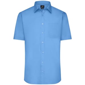 A short-sleeved button-up shirt in a light blue colour with a chest pocket and a logo on the neckline.