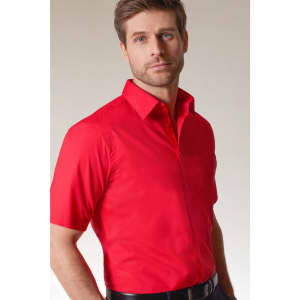 A red short-sleeve button-up shirt on a man, featuring a collar and a fitted design. The shirt has a logo.