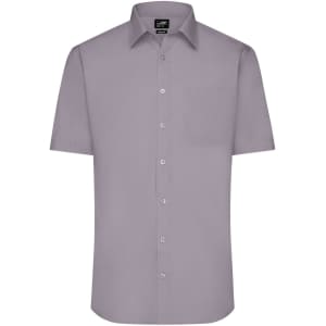 A short-sleeve, button-up shirt in a light purple shade featuring a pocket and a logo on the label.