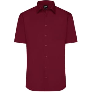 A short-sleeved, burgundy button-up shirt with a single chest pocket and a collar. It features a logo at the neck.
