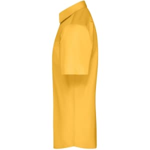 A short-sleeved, button-up shirt in mustard yellow, featuring a collar and a logo.