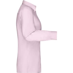 A light pink button-up shirt with long sleeves, featuring a collar and a logo.