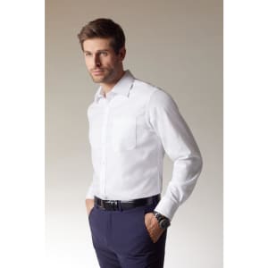 A white button-up shirt with a chest pocket, worn by a man, paired with dark trousers and a watch.