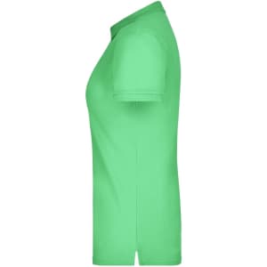 A green ladies' polo shirt with short sleeves and a collar, featuring a logo on the chest.