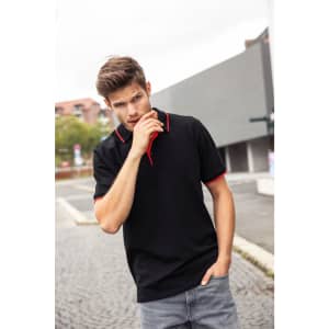 A black polo shirt with red accents, featuring a logo on the chest, displayed on a male model.