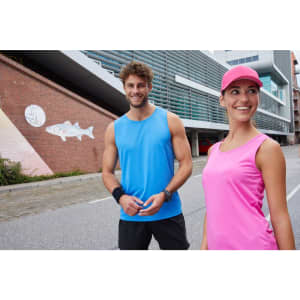 A blue active tank top on a man and a pink active tank top on a woman, both posing outdoors.
