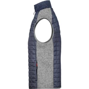 A men's knitted hybrid vest featuring a grey body and navy quilted panels, with an open arm design and a zip pocket.