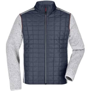 A knitted hybrid jacket in navy and grey, featuring a zip front and quilted design with contrasting sleeves.