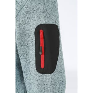A close-up of a ladies' knitted fleece jacket in grey, featuring a red zippered pocket on the arm.