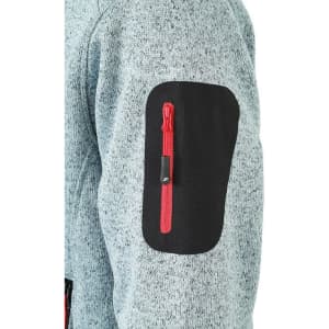 A grey knitted fleece jacket with a black patch on the sleeve, featuring a small red zip pocket.