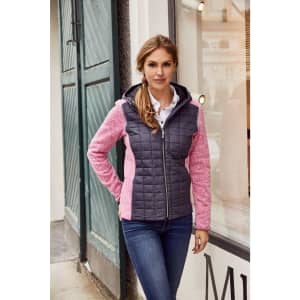 A ladies' knitted hybrid jacket featuring a grey quilted front and pink sleeves, paired with blue jeans.