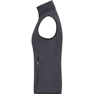 A dark grey knitted fleece vest featuring a zip pocket and a high collar. It has a sleeveless design.