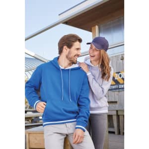 A blue hoodie with white stripes in a casual setting, paired with a light grey hoodie worn by a smiling woman.