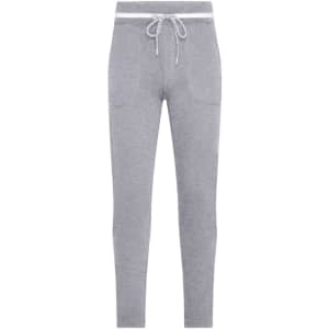 Grey jog pants featuring a drawstring waist and pockets. The design is casual and fitted, ideal for relaxed wear.
