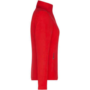 A red polar fleece jacket featuring a zippered pocket and a high collar. It has a logo on the garment.
