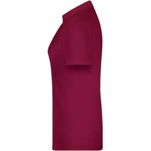 A maroon polo shirt for women, featuring a classic design and a fitted silhouette. It has a logo on the side.