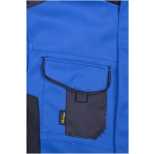 A blue softshell jacket featuring a contrasting dark pocket and a logo on the pocket.