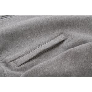 A grey sweat jacket featuring a concealed pocket detail and a soft fabric texture.