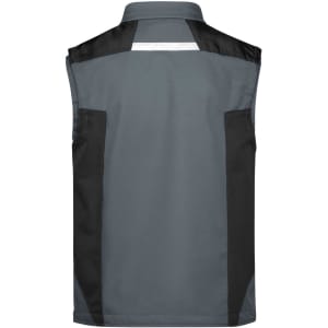A grey workwear softshell vest featuring black panels and a reflective strip on the back. It has a logo.