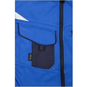 A blue workwear softshell vest featuring a navy pocket and a logo, highlighting its durable design.