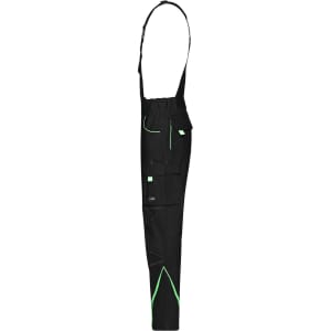 Black workwear pants with bib and green accents, featuring multiple pockets and adjustable straps.