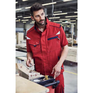 A red workwear vest with contrast detailing and a logo, designed for durability in work environments.