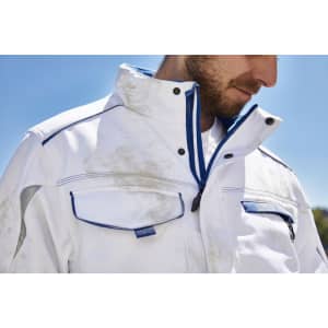 A padded softshell jacket in white with blue accents, featuring multiple pockets and a high collar.