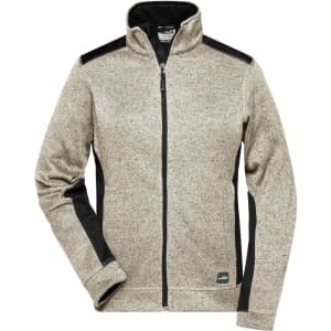 A ladies' knitted workwear fleece jacket in beige with black accents and a high collar. It features a zip front and logo.