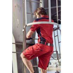 Red work shorts with pockets, paired with a matching short-sleeve shirt. The model is climbing a ladder.