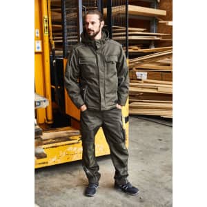 A padded work jacket in khaki, featuring a hood and multiple pockets, worn by a man in a warehouse setting.