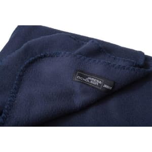 A navy fleece blanket with neatly stitched edges and a label.