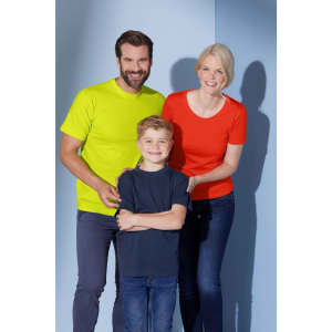 A family poses in vibrant shirts: a bright yellow adult tee, a navy children's tee, and a red women's tee.