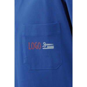 A blue polo shirt featuring a pocket with a logo, including scissors and a comb design.