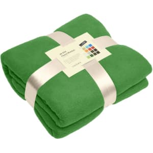 A folded green fleece blanket tied with a ribbon, featuring a tag with colour options.