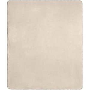 A bonded fleece blanket in a soft beige colour, featuring a smooth texture and a stitched border.