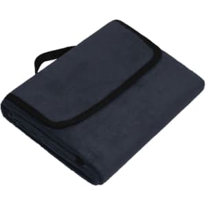 A navy picnic blanket with a black trim and a carrying strap, folded neatly.