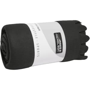 A rolled black fleece blanket with a branding label, featuring a soft texture and a simple design.