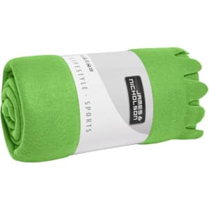 A rolled green fleece blanket with a label featuring branding.