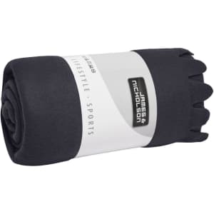 A rolled navy fleece blanket with a white band featuring branding. Soft texture and compact design for easy storage.