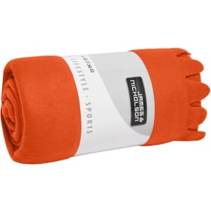 An orange fleece blanket rolled and secured with a branded band, showcasing a soft texture.