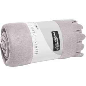 A rolled grey fleece blanket with a white branded band around it.
