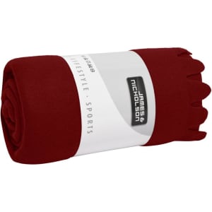 A rolled burgundy fleece blanket with a white band featuring a logo.