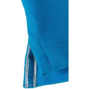 A close-up of a blue polo shirt, featuring a stitched hem and a small slit at the side. The shirt has a brand logo.