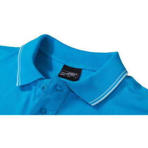 A blue men's polo shirt with a contrasting white collar and a branded label.