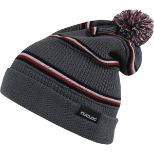 A grey beanie featuring red and white stripes and a pom-pom on top, complete with a branded tag.